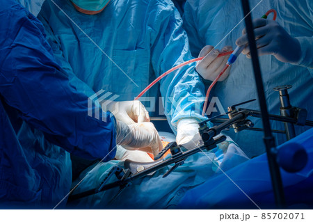 Hands of doctors in sterile gloves Hands of doctors in sterile gloves 85702071