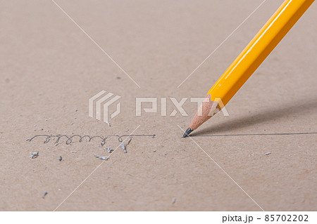 Close up a sharpened pencil writing a straight line 85702202