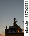 silhouette of a buddha statue 85702554