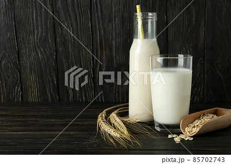 Concept of vegan milk on wooden background 85702743