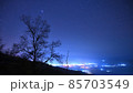 Night sky over small town in mountains 85703549