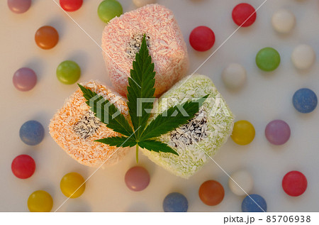 Turkish delight and colorful candy confetti with green cannabis leaf. 85706938