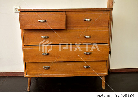 Old bedside table with drawers and handles. Old bedside table with drawers and handles. 85708334