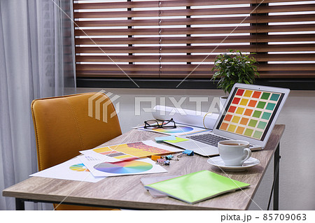 Modern designer's workplace with stylish new laptop 85709063