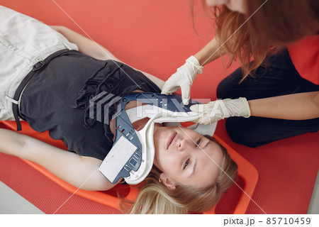 Woman learns to do artificial respiration. 85710459