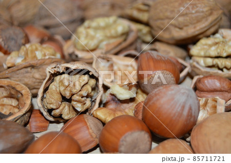 Almonds, hazelnuts, walnuts and other. Healthy food snack mix on white table, top view, copy space 85711721