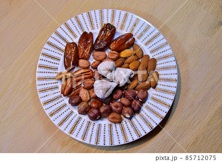 Almonds, hazelnuts, walnuts and other. Healthy food snack mix on white table, top view, copy space 85712075