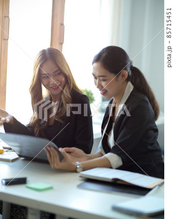 Business worker having a conversation in the office workplace. 85715451