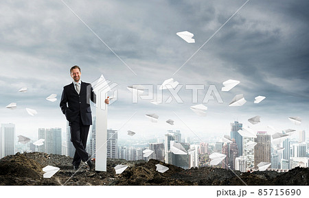 Conceptual image of businessman in ruins 85715690