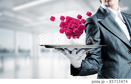 Hand of waiter presenting cubes on tray. 85715974