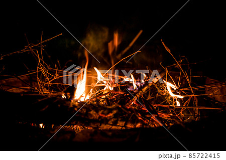 fire and flames. Flames and burning sparks close up, fire patterns. flames from the fire. Night bonfire, logs are on fire, sparks fly. soft focus.shallow focus effect.. 85722415