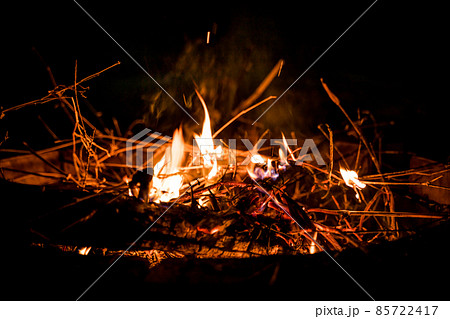 fire and flames. Flames and burning sparks close up, fire patterns. flames from the fire. Night bonfire, logs are on fire, sparks fly. soft focus.shallow focus effect.. fire and flames. Flames and burning sparks close up, fire patterns. flames from the fire. Night bonfire, logs are on fire, sparks fly. soft focus.shallow focus effect.. 85722417