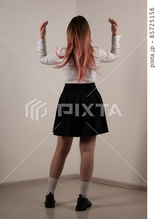 Plump teen girl posing in school uniform Plump teen girl posing in school uniform 85725156