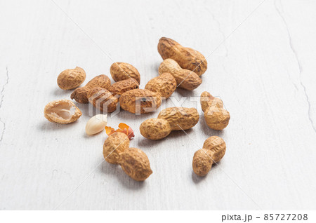 peanuts in a shell on a light background 85727208