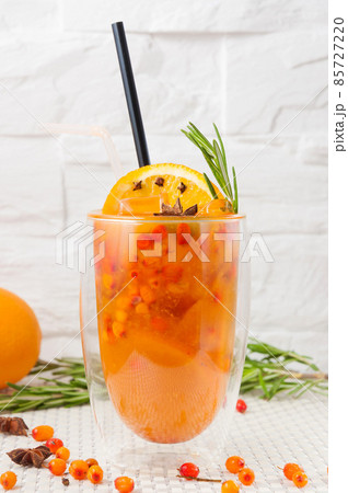 sea buckthorn refreshing drink on a light background sea buckthorn refreshing drink on a light background 85727220