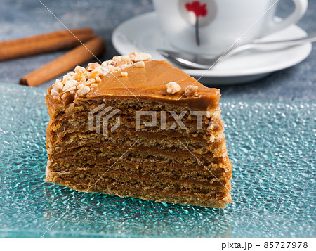 cake with boiled condensed milk on a glass plate 85727978