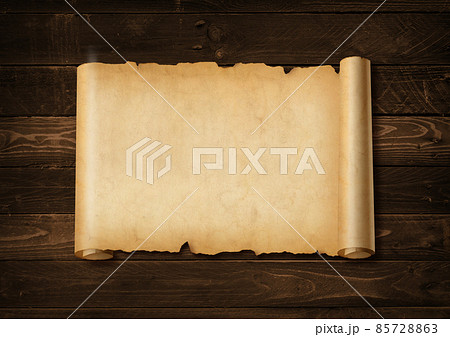 Old mediaeval paper sheet. Horizontal parchment scroll on a wood board 85728863