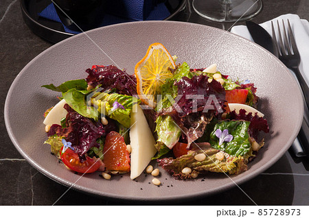 salad with goat cheese and vegetables. Vegetarian food 85728973