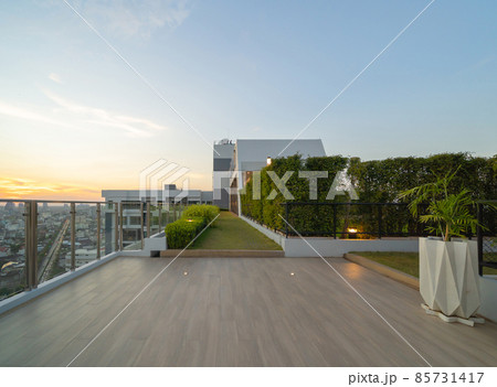 Sky garden on private rooftop of condominium or hotel, high rise architecture building with tree, grass field, and blue sky. Sky garden on private rooftop of condominium or hotel, high rise architecture building with tree, grass field, and blue sky. 85731417