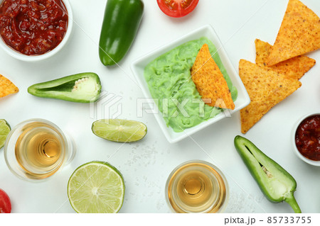 Party concept with tequila, guacamole and chips 85733755