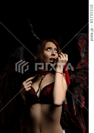 Alluring woman in lingerie with neck collar Alluring woman in lingerie with neck collar 85735310