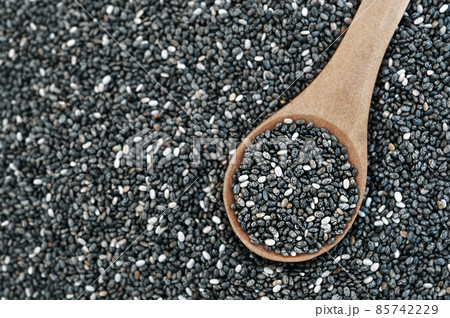 Chia seeds (Salvia hispanica) in wooden spoon, gluten free ancient grain for healthy diet, selective focus, shallow DOF 85742229