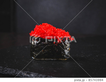 Sake Maki Sushi - Roll with Fresh Salmon and Cucumber inside. Topped with Salmon Caviar 85743994