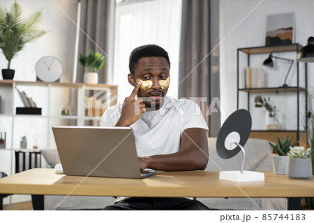 Young handsome caucasian man performs hygienic procedures at home 85744183
