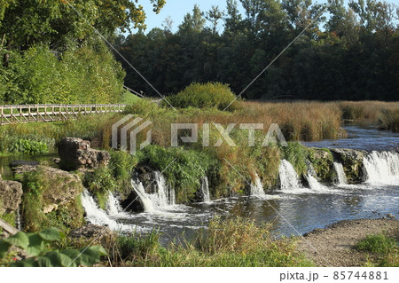 Ventas Rumba Waterfall and wooden bridges on the Venta river. Kuldiga, Latvia. High quality photo Ventas Rumba Waterfall and wooden bridges on the Venta river. Kuldiga, Latvia. High quality photo 85744881
