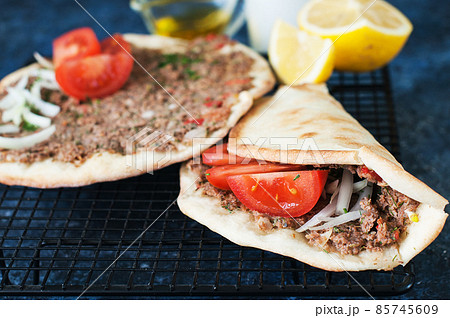 Lahmacun Turkish traditional cuisine, flatbread with minced meat and spices. 85745609