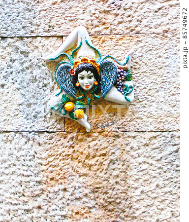 Triskelion - motif used in the flag of Taormina, found on one the walls, Sicily island, Italy 85749672