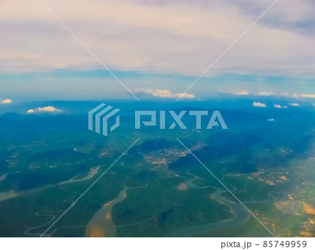 The sea view from airplane porthole window The sea view from airplane porthole window 85749959