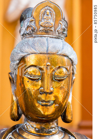 Face portrait of the ancient statue of Guanyin, Guan Yin or Kuan Yin Face portrait of the ancient statue of Guanyin, Guan Yin or Kuan Yin 85750985