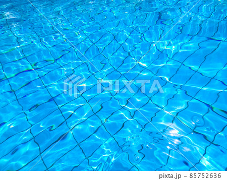 Blue pool water with sun reflections Blue pool water with sun reflections 85752636
