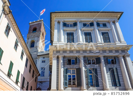 Facade of an old Italian building in old part of town, windows with shutters, old building in Genoa, Italy. Facade of an old Italian building in old part of town, windows with shutters, old building in Genoa, Italy. 85752696