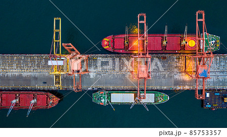 Aerial view bulk carrier dock, Global business import export logistic and transportation company, Commercial dock container cargo vessel freight shipping worldwide. 85753357