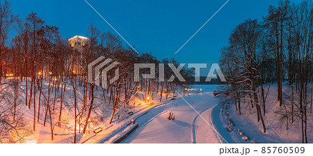 Gomel, Belarus. City Park In Winter Night. Clock Tower Of Rumyantsevs And Paskeviches Palace And Frozen Pond In Homiel Park, Belarus. Famous Local Landmark In Snow. Panorama Gomel, Belarus. City Park In Winter Night. Clock Tower Of Rumyantsevs And Paskeviches Palace And Frozen Pond In Homiel Park, Belarus. Famous Local Landmark In Snow. Panorama 85760509