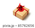 Elegant design of present gift box wrapped in brown craft paper with red ribbon 85762656