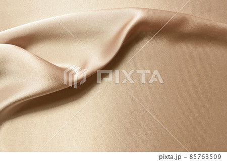 Golden silk fabric background, smooth and floating texture for design background 85763509
