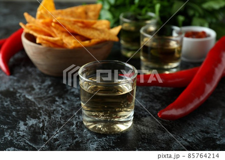 Party concept with tequila, guacamole and chips 85764214