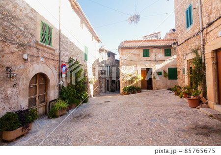 Beautiful street in Valldemossa, famous old mediterranean village of Majorca Spain. Beautiful street in Valldemossa, famous old mediterranean village of Majorca Spain. 85765675