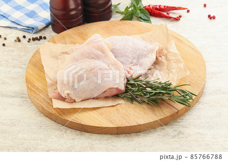 Raw chicken thighs over board Raw chicken thighs over board 85766788