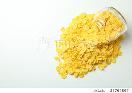 Jar of corn flakes on white background Jar of corn flakes on white background 85766897