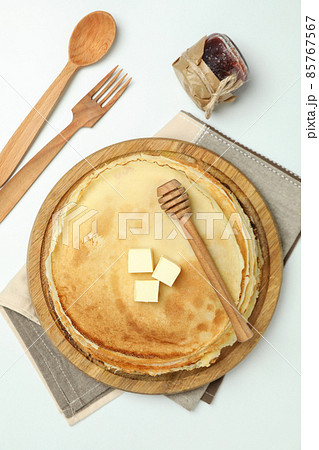 Concept of tasty food with crepes on white background Concept of tasty food with crepes on white background 85767567