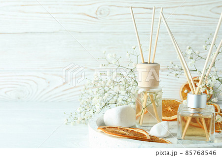 Aromatic concept with diffusers on white wooden table Aromatic concept with diffusers on white wooden table 85768546