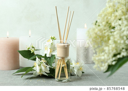 Aromatic concept with diffuser on gray textured table Aromatic concept with diffuser on gray textured table 85768548