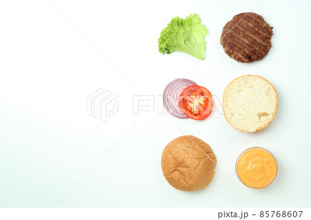 Concept of cooking burger on white background, top view Concept of cooking burger on white background, top view 85768607