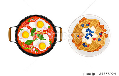 Breakfast meal dishes set. Fried eggs and Belgian waffles served on plates vector illustration 85768924