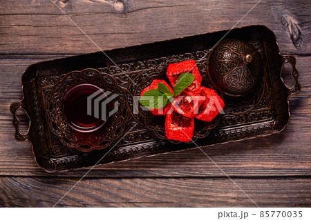 Traditional Turkish Delight with glass of tea Traditional Turkish Delight with glass of tea 85770035