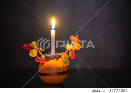 Orange Christingle is a symbolic object used in the Advent, Christmas and Epiphany services of many Christian denominations Orange Christingle is a symbolic object used in the Advent, Christmas and Epiphany services of many Christian denominations 85772065